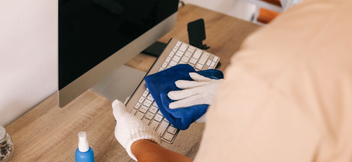 man-cleaning-computer-keyboard-2023-09-27-02-32-22-utc