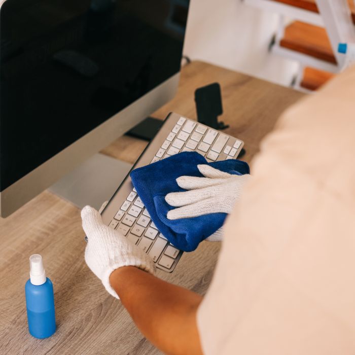 man-cleaning-computer-keyboard-2023-09-27-02-32-22-utc